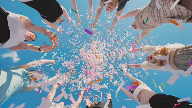 Elder smiling cheerful fun happy satisfied parent mom with young adult daughter two women together wearing casual clothes throw up confetti isolated on plain blue cyan background. Family day concept