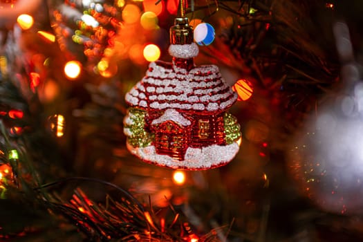 Beautiful festive decorations on the Christmas tree. Close-up. Beautiful Christmas background. The concept of decorations and decor for the new year. New Year's Card 2025. High quality photo