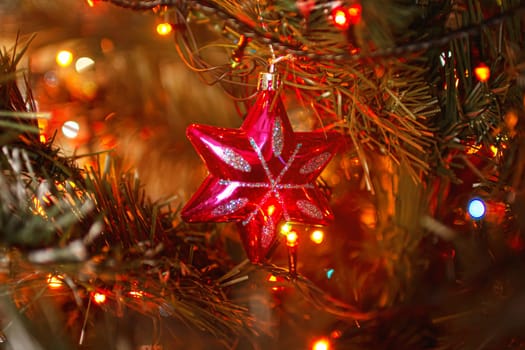 Beautiful festive decorations on the Christmas tree. Close-up. Beautiful Christmas background. The concept of decorations and decor for the new year. New Year's Card 2025. High quality photo