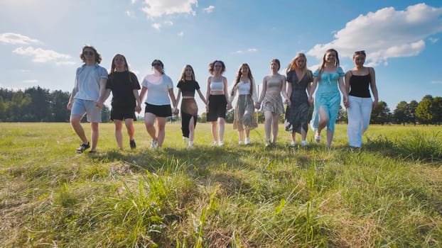 A joyful gathering of close friends happily enjoying a beautiful sunny day in a vibrant open field together
