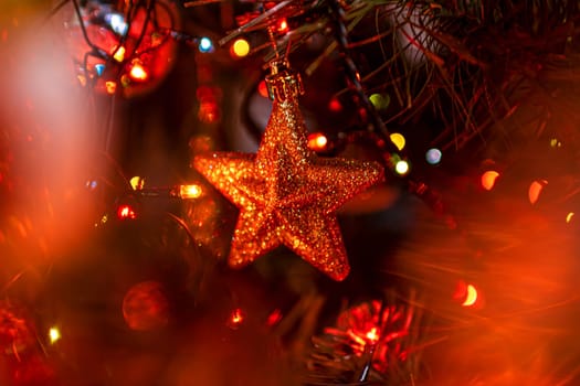 Beautiful festive decorations on the Christmas tree. Close-up. Beautiful Christmas background. The concept of decorations and decor for the new year. New Year's Card 2025. High quality photo