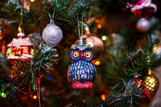 Beautiful festive decorations on the Christmas tree. Close-up. Beautiful Christmas background. The concept of decorations and decor for the new year. New Year's Card 2025. High quality photo