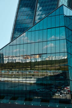 An intricate glass structure reflecting the surrounding urban landscape with stunning visual elegance and details
