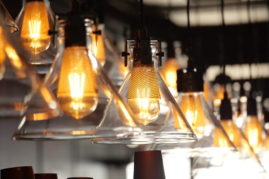 Stylish illuminated pendant lights create a warm, inviting ambiance throughout the room