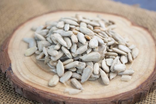 Close-Up Of Sunflower Seeds On Rustic Wooden Surface,