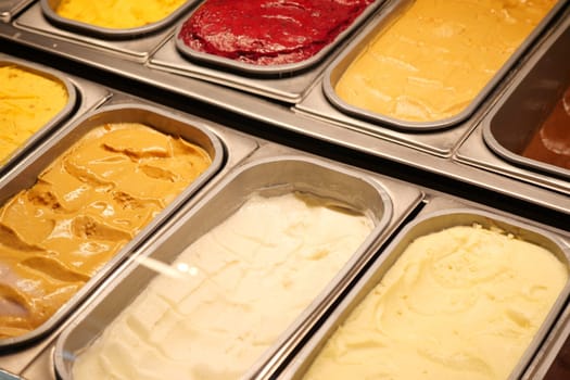 chocolate, vanila and orange favor of ice cream display for sale .