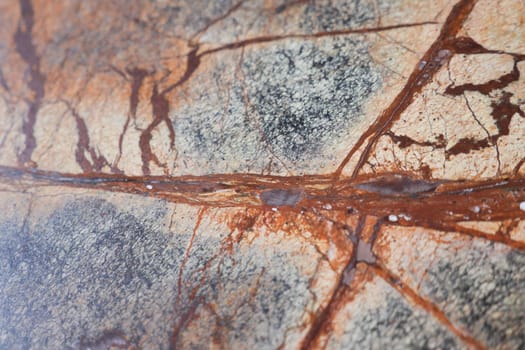A closeup of a unique stone surface, showcasing its natural patterns and colors