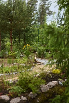 A peaceful and tranquil garden scene showcasing a winding path surrounded by vibrant flowers and lush greenery