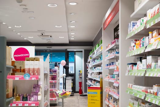 Cremona, Italy - November 20th 2024 Wide shot of a well-stocked pharmacy interior, showcasing a variety of healthcare products and promotions in cremona, italy