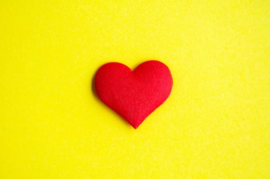 Heart shape on yellow background cover with customizable space for text or message. Love concept and copy space.