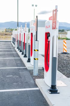 Beaver, Utah, USA-October 10, 2021 - Empty Tesla charging stations in early morning.