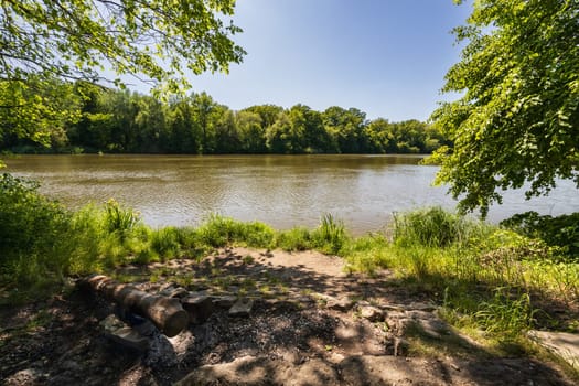 Beautiful small square next to river for rest next to footpath at beautiful green surroundings