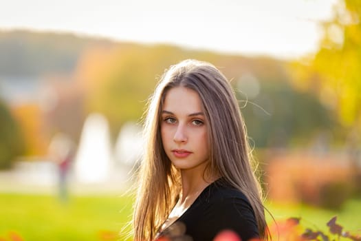 Portrait of a beautiful girl in an autumn park