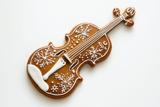 This beautifully decorated gingerbread cookie shaped like a violin is perfect for all kinds of festive celebrations