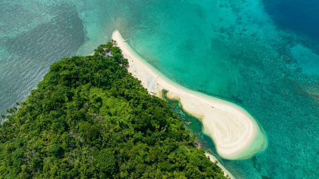 Aerial view of beautiful beach on a tropical island and blue sea. Agutaya island, Philippines.
