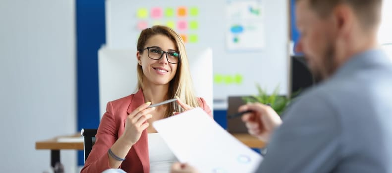 Portrait of cheerful optimistic woman listen to colleague report, office worker in suit. Woman boss proud of her worker. Business, career, strategy concept
