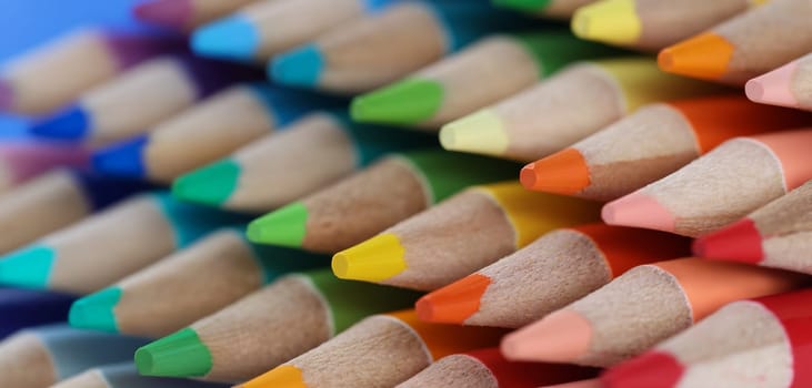 Close-up of sharpened colourful pencil set for painting forming stack. Pigmented crayons for drawing on paper. Vision, imagination, creativity, art concept