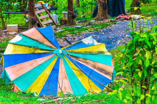 Old dirty broken parasol in Sakhu Thalang on Phuket island Thailand in Southeastasia Asia.