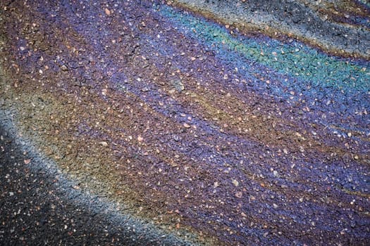 Vibrant oil patch drawing attention on the asphalt pavement