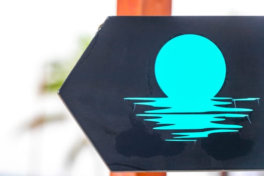 Directional signs sign on the beach in Playa del Carmen Quintana Roo Mexico.