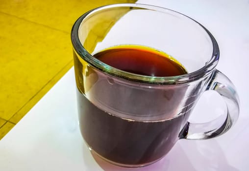 Glass with black coffee on the table in Cancun Quintana Roo Mexico.