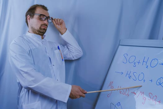 A scientist in a lab coat and glasses pointing at chemical formulas on a whiteboard, emphasizing science education, research, and explanation of complex concepts