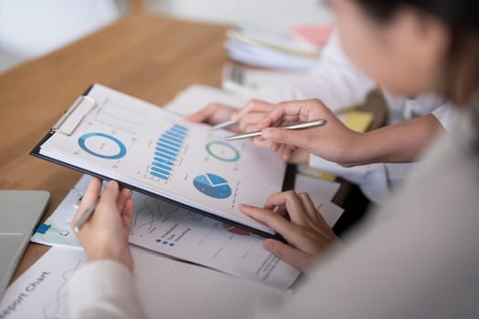 Business team analyzing income chart and graph in office. Close up. Business analysis and strategy concept.