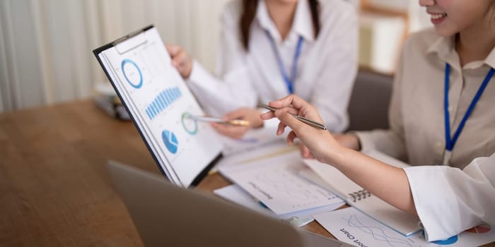 Business team analyzing income chart and graph in office. Close up. Business analysis and strategy concept.