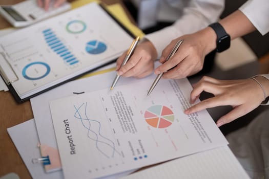 Business team analyzing income chart and graph in office. Close up. Business analysis and strategy concept.