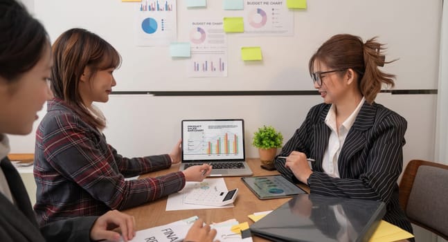 Young business team analyze income charts and graph with modern laptop computers and strategic business idea.
