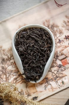 Highquality loose black tea leaves are beautifully arranged and showcased in a decorative and stylish bowl
