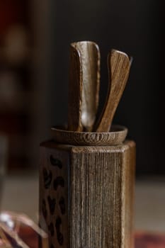 This beautifully crafted wooden knife holder showcases an elegant design, exceptional craftsmanship, and functionality
