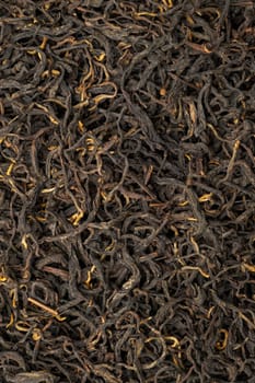 A closeup photograph showcasing aromatic loose black tea leaves, ideal for brewing wonderfully flavorful tea