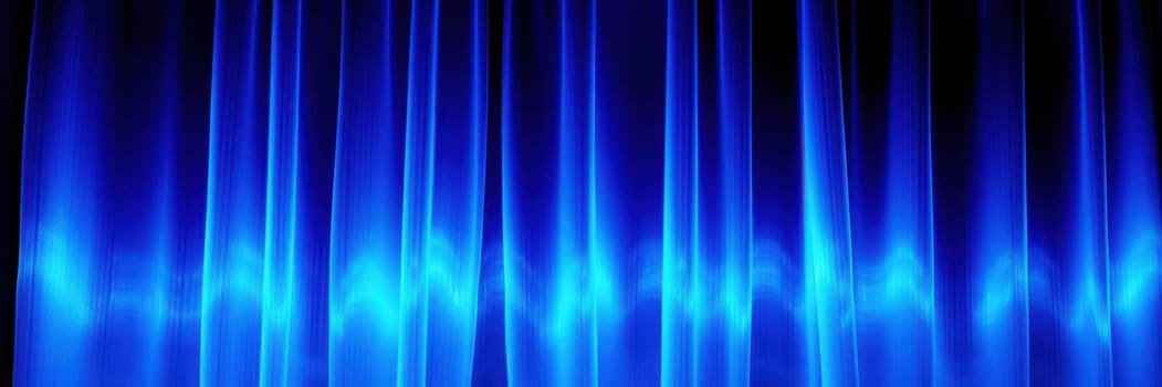 Soft blue lights illuminate the flowing curtains, enhancing the atmosphere of the indoor venue during a captivating performance or entertainment event, inviting audience engagement.