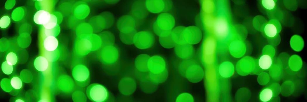 Bright green bokeh lights form a lively backdrop, perfect for festive occasions like parties, holidays, and special events. The soft glow adds a whimsical atmosphere.