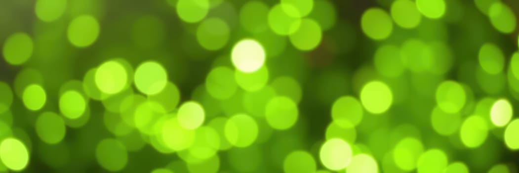 Bright green lights create a mesmerizing bokeh effect that fills the space with a lively and festive mood. The soft glow enhances any setting or celebration.