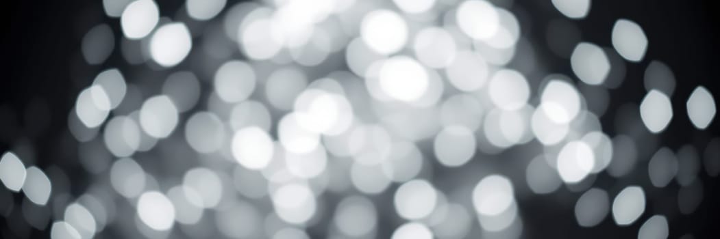 The soft, shimmering lights create a mesmerizing bokeh effect, setting a serene and elegant mood for a special gathering during the evening hours.