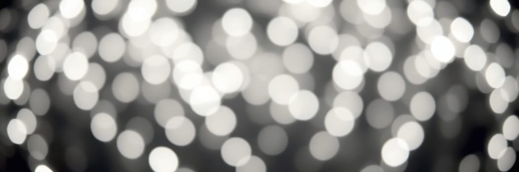 Soft, glowing lights fill the atmosphere with a magical ambiance during an evening celebration. The blurred effect adds a sense of enchantment and joy to the event.