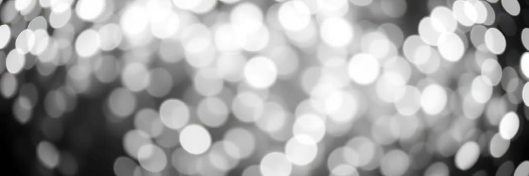 Soft, luminous circles of light blend into a mesmerizing background, enhancing the joyful ambiance of a night filled with celebration and excitement.