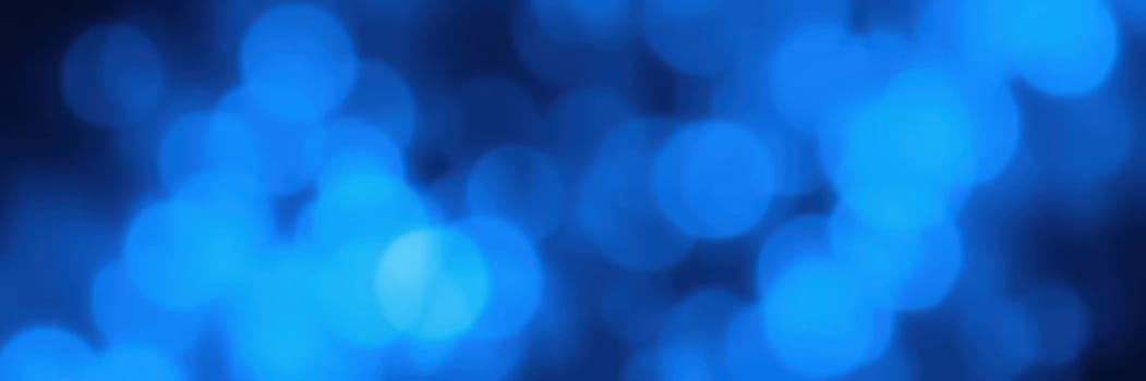Soft blue bokeh shapes create a tranquil ambiance suitable for various designs. The circular forms blend seamlessly, enhancing visual aesthetics and evoking serenity.