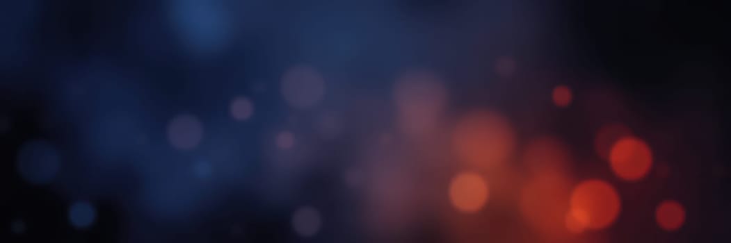 A vibrant display of colorful bokeh fills the scene, combining shades of blue and orange.