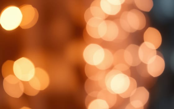 Soft bokeh lights illuminate a gathering, creating a cozy and festive atmosphere. The warm glow adds charm to the evening, inviting people to enjoy the moment.