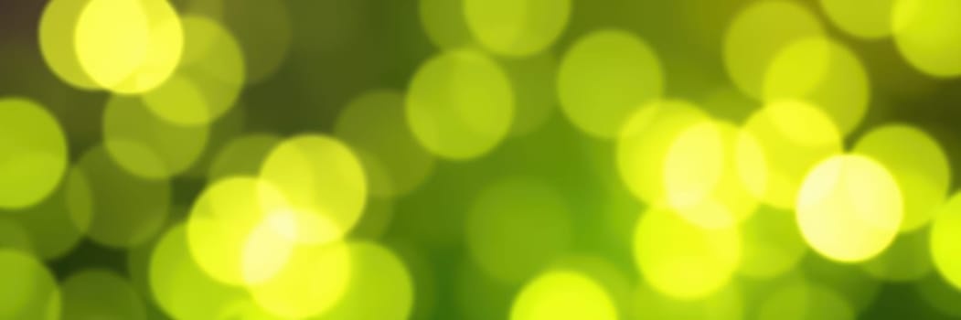 Shimmering green bokeh lights fill the space, creating a serene and enchanting ambiance for guests. The warm glow enhances the cozy evening atmosphere.