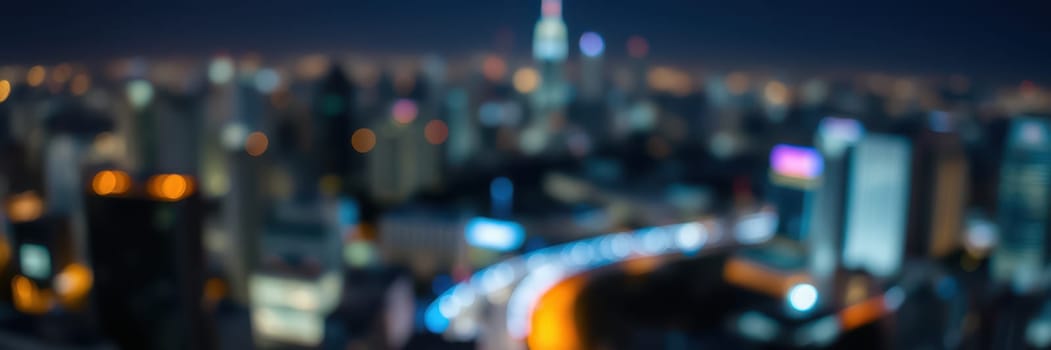 A bustling city skyline glows under the night sky, with bright lights from buildings and streets creating a lively ambiance. The blurred effect adds to the dynamic urban energy.