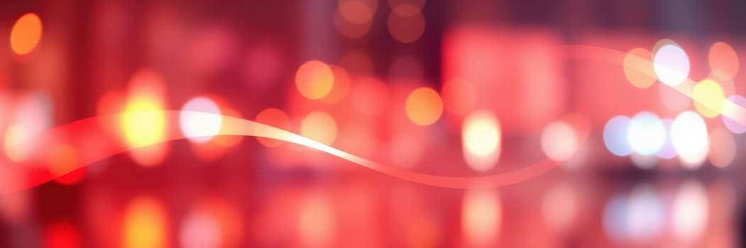 Bright city lights illuminate the streets at night, creating a vibrant and lively atmosphere. The colorful bokeh effects add an artistic touch to the urban landscape.
