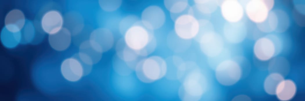 Soft blue bokeh lights blend harmoniously to create an enchanting background effect ideal for a variety of artistic designs or digital projects.