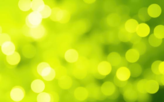 A vibrant display of bright green hues featuring a bokeh effect creates an abstract representation of nature's freshness. The blurred circles give a sense of movement and serenity.