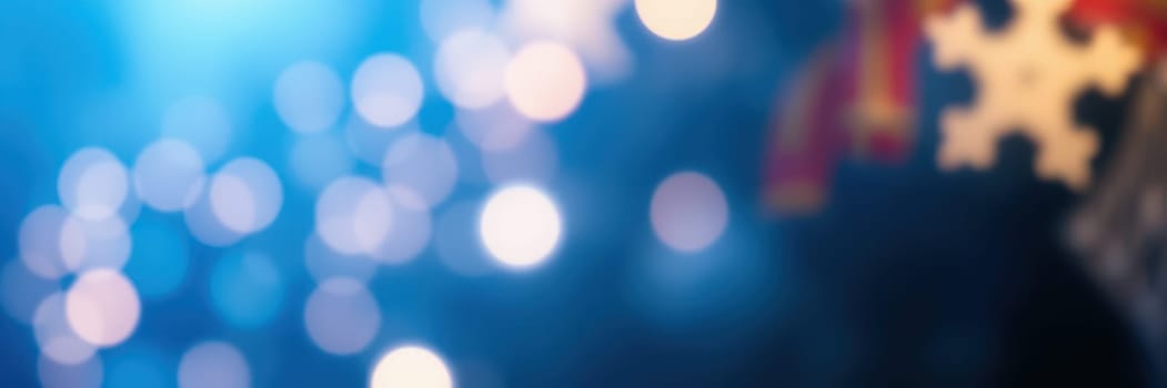 Bright bokeh lights illuminate the background as attendees enjoy various activities at a winter celebration held in a community setting, creating a festive mood.