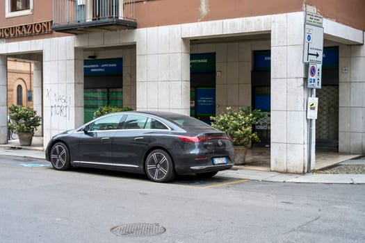 Lombardy, Italy - November 20th 2024 Sleek, gray mercedes-benz eqs 450 electric sedan parked on a city street, showcasing modern automotive design and sustainable transportation