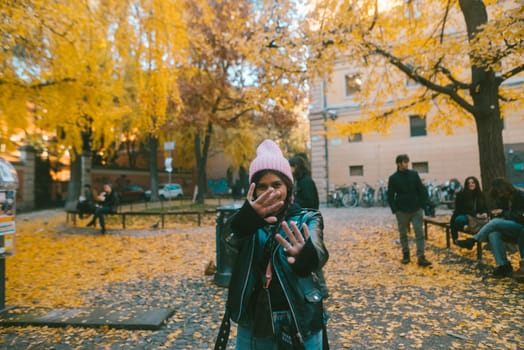 An incredibly vibrant autumn scene beautifully capturing a joyful moment right in a leafstrewn park
